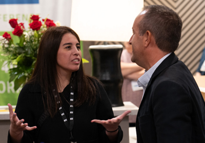 A woman and man talking to each other