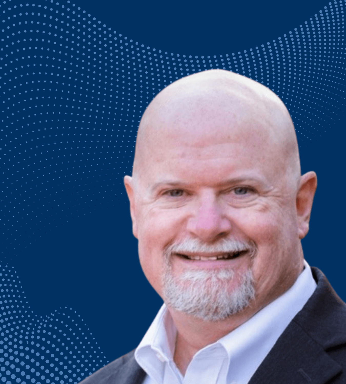 Mike Pappas in front of navy blue background